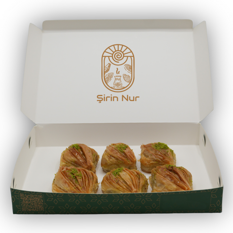 Midye Baklava – mussel-shaped Turkish pastry with buttery layers and rich pistachio filling. Crunchy, flaky, and indulgent.